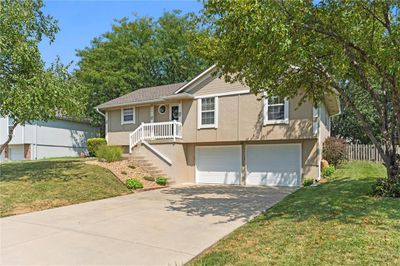 View of front of house with a front yard and a garage | Image 3