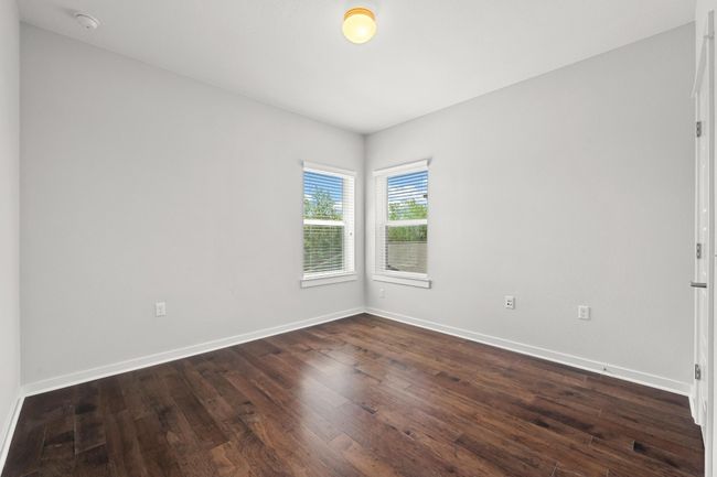 The guest bedrooms provide a peaceful retreat with ample closet space and easy access to the full bathroom, ensuring both convenience and comfort | Image 32