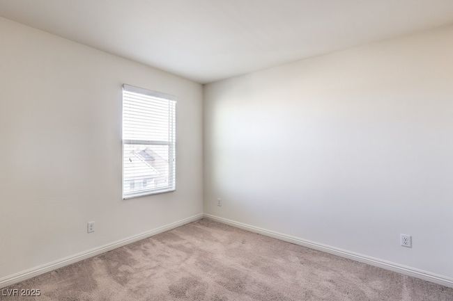 Empty room featuring light carpet and baseboards | Image 26