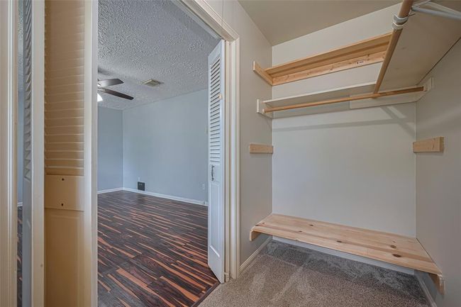 View from inside the closet to the bedroom. | Image 31