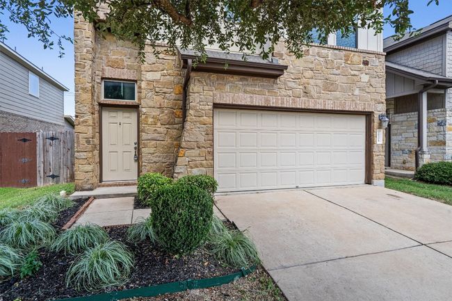 View of front of house featuring stone siding and concrete driveway | Image 9