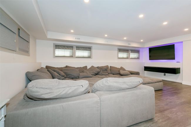 Living room with baseboards, visible vents, wood finished floors, and recessed lighting | Image 27