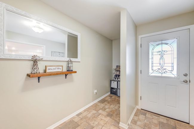 Spacious entryway between garage and kitchen. | Image 6