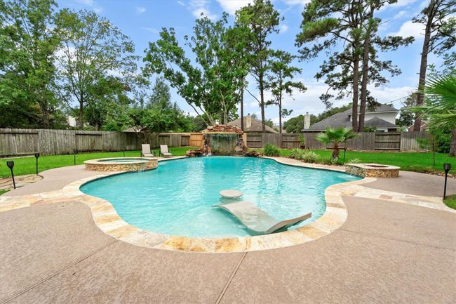 And did we mention tropical paradise? This gorgeous 42, 000 gallon pool with a unique stone grotto and water features | Image 36