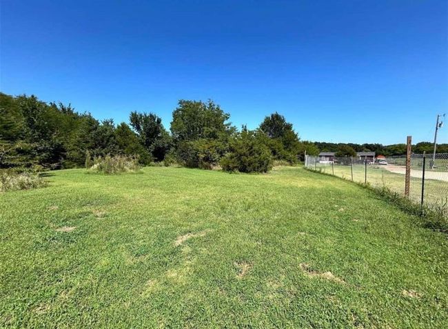 View of yard with a rural view and fence | Image 4