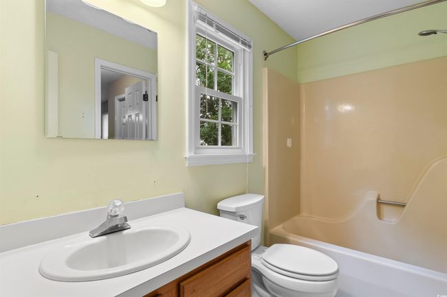 Full bath featuring vanity and shower / washtub combination | Image 25