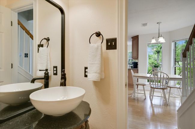 The centrally located half bathroom offers added convenience for guests and daily use. | Image 22