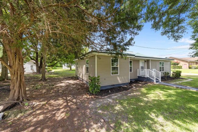 View of front of home featuring crawl space and a front yard | Image 8