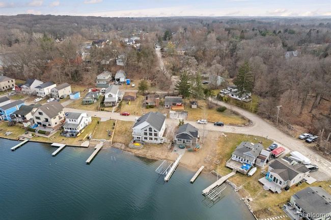 View of home from water and the vacant lot | Image 2