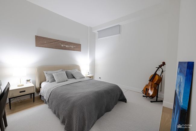 Bedroom featuring light wood finished floors and baseboards | Image 14