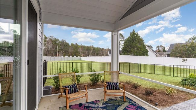 Sunroom featuring lofted ceiling | Image 33