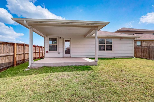 Rear view of property with a patio area and a fenced backyard | Image 37