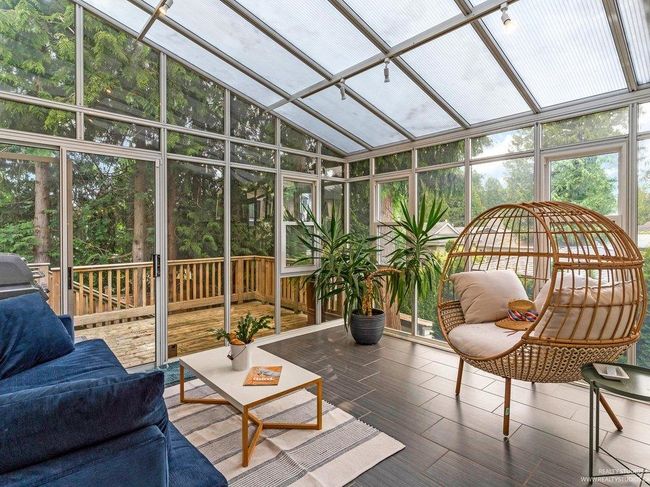 Forest and sun bathe in your x-large sun drenched solarium, inviting morning and afternoon east and southern sunshine into your home, with breathtaking views and ultra privacy thanks to a backdrop of trees creating a wall of privacy. | Image 18