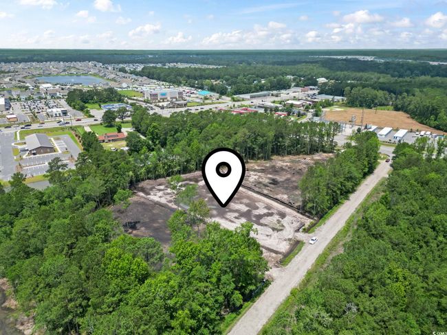 Aerial view of a heavily wooded area | Image 8
