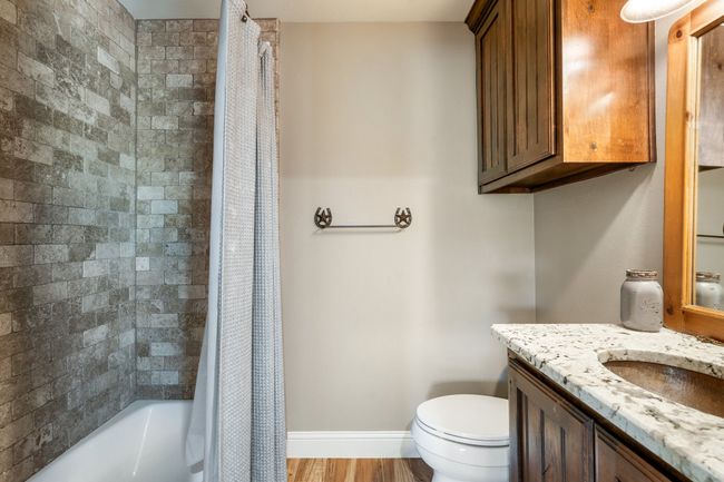 Bathroom with vanity and shower / tub combo | Image 31