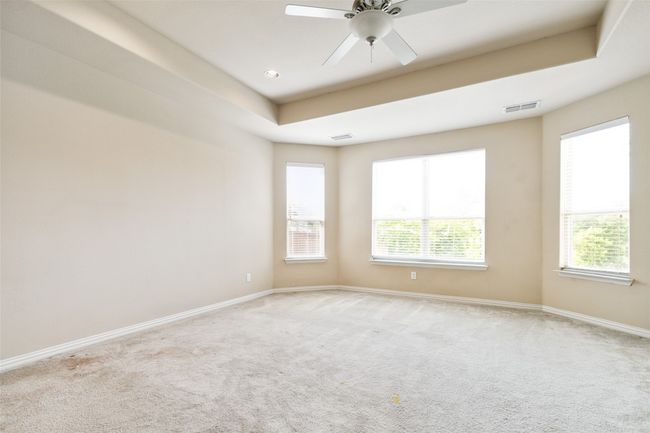Spare room with carpet flooring, baseboards, and a ceiling fan | Image 27