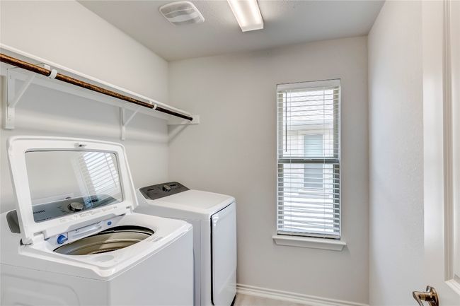Laundry room with independent washer and dryer, healthy amount of natural light, and baseboards | Image 29