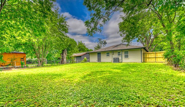 View of fenced backyard | Image 26
