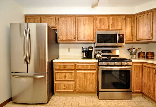 Beautiful stainless steel appliances and plenty of cabinets and counter space! | Image 19