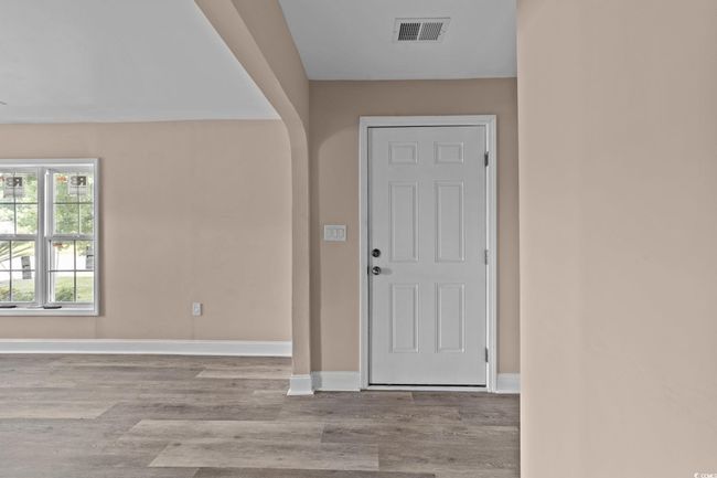 Foyer with wood finished floors and baseboards | Image 17