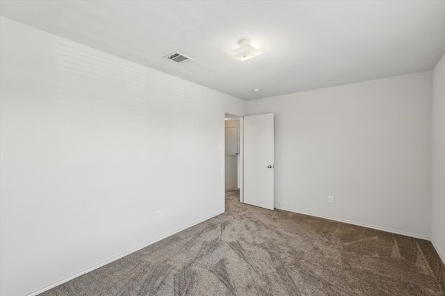 Carpeted spare room featuring baseboards | Image 26