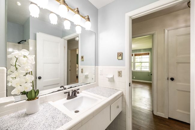 The vanity area is very spacious and there is a linen closet. | Image 60