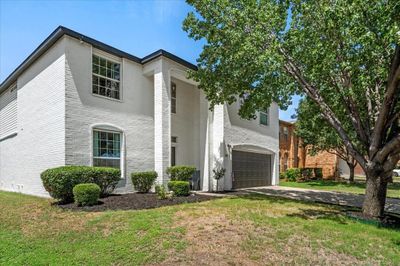 View of front of house with a garage and a front yard | Image 3