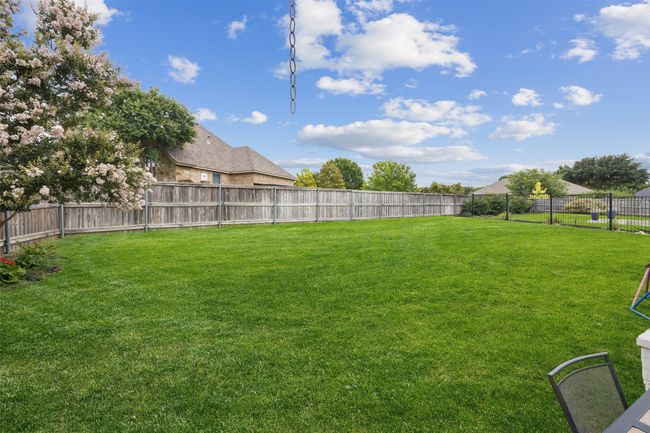 View of fenced backyard | Image 34