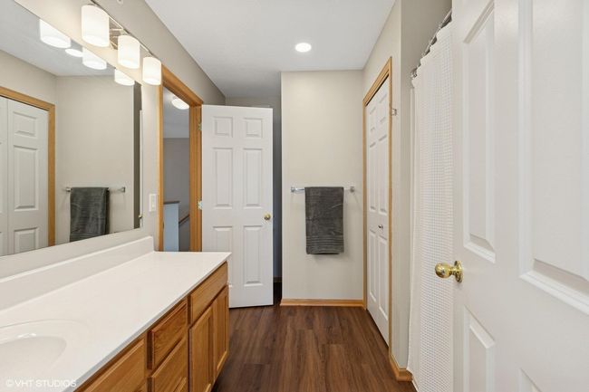 This bathroom features two doors, providing convenient access from both the upper-level hallway and the primary bedroom | Image 33