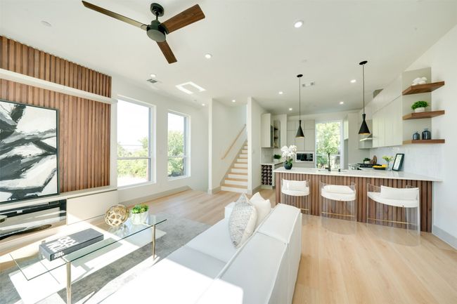 Living room with light hardwood / wood-style floors, sink, and ceiling fan | Image 9