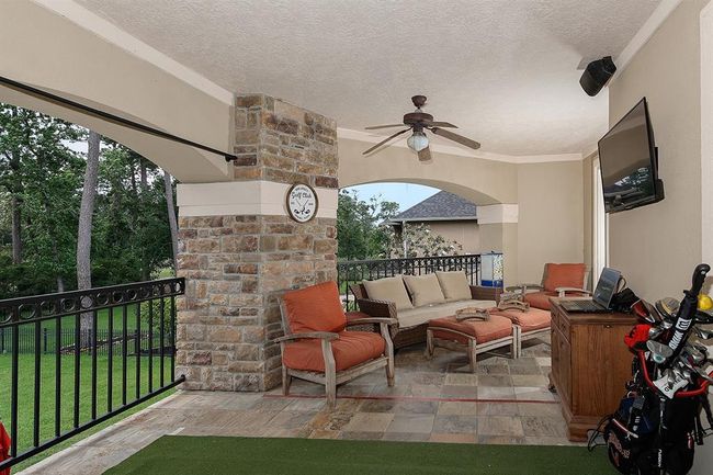 Expansive balcony with sweeping golf course views and tv mount | Image 35