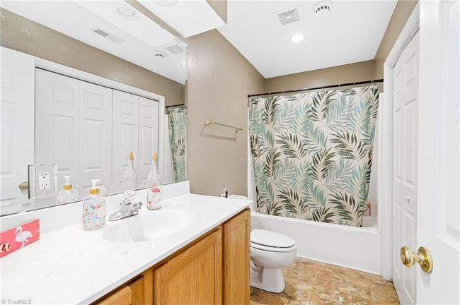 Full lower level bath features tub/shower, large vanity, and washer/ dryer hookups conventiently located in the double door closet. | Image 29