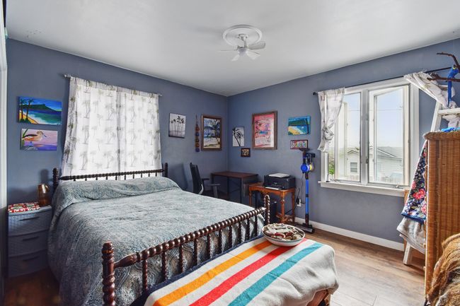 Bedroom with wood finished floors and baseboards | Image 7