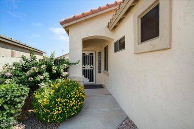 The home has a side entry to the front door with a security door... great to enjoy soft breezes! | Image 2