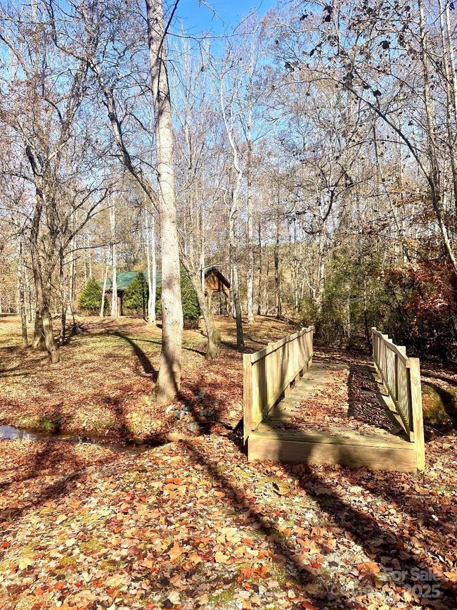 Charming wooden bridge allows access to leisure. | Image 14