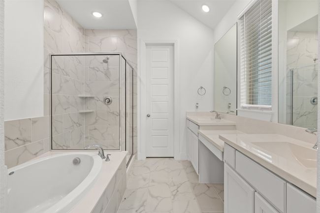 Bathroom featuring marble finish floor, a stall shower, a sink, and a bath | Image 20