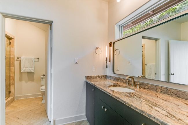 Bathroom featuring vanity, healthy amount of natural light, and a stall shower | Image 26