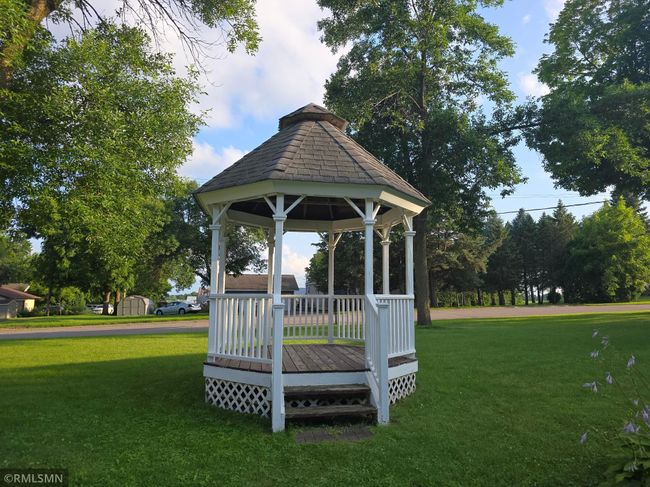 The vintage gazebo provides a wonderful, covered space to sit and enjoy the outdoor space. | Image 23