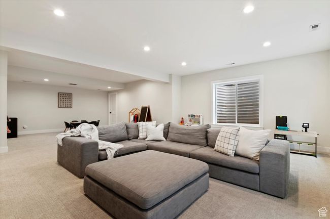 Living area featuring light colored carpet, baseboards, and recessed lighting | Image 26