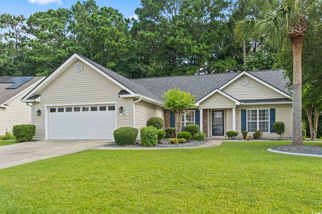 Ranch-style home featuring a shingled roof, an attached garage, concrete driveway, and a front yard | Image 32