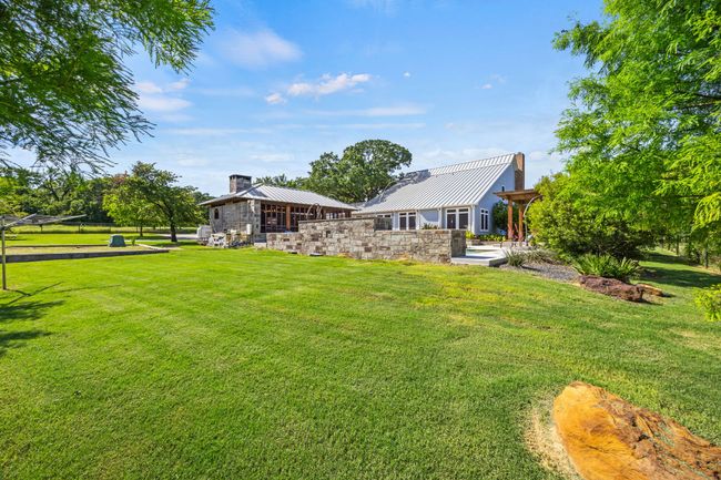 Back View of Yard, Pool, and Outdoor Living Center | Image 33