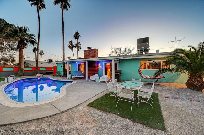 View of swimming pool featuring a patio and central air condition unit | Image 38