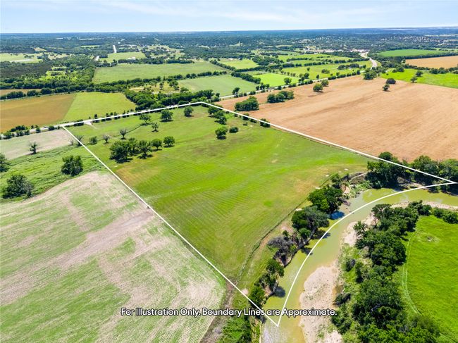 Aerial view of sparsely populated area featuring property parcel outlined and agricultural land | Image 8