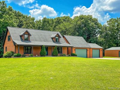 7653 Chase Lake Road, Home with 3 bedrooms, 2 bathrooms and null parking in Conway Twp MI | Image 2