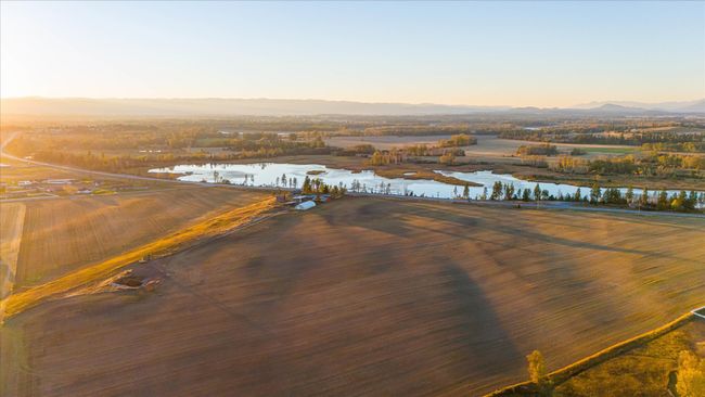 Aerial view at dusk featuring a water and mountain view | Image 68