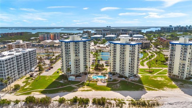 View of urban area featuring a nearby body of water and a pool area | Image 29