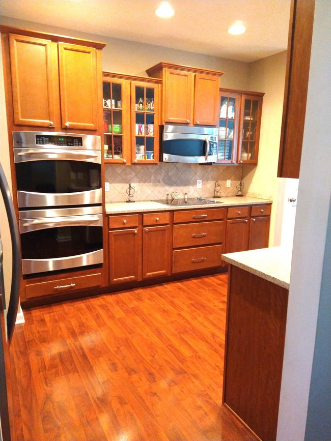 dining area featuring baseboards and dark wood-type flooring | Image 8