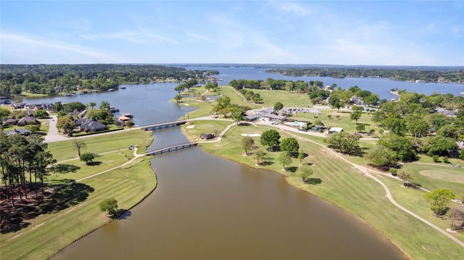 View of property location with a nearby body of water and a golf club | Image 25