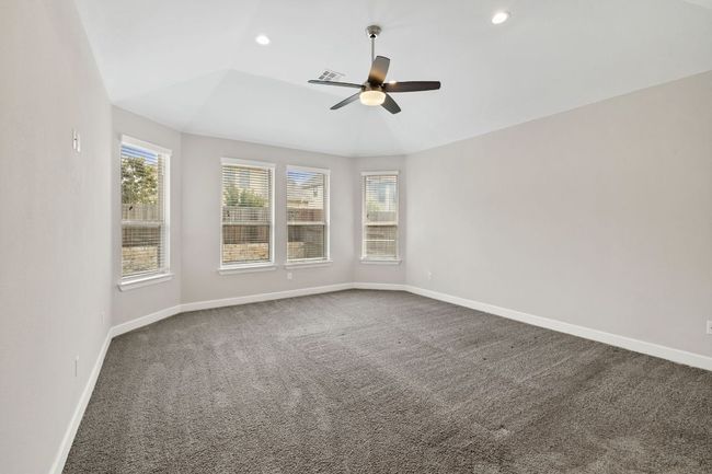 Spare room featuring baseboards, recessed lighting, a ceiling fan, and carpet floors | Image 19