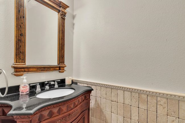 1/2 bathroom (downstairs) located in the hallway between the formal dining area and the living room | Image 9